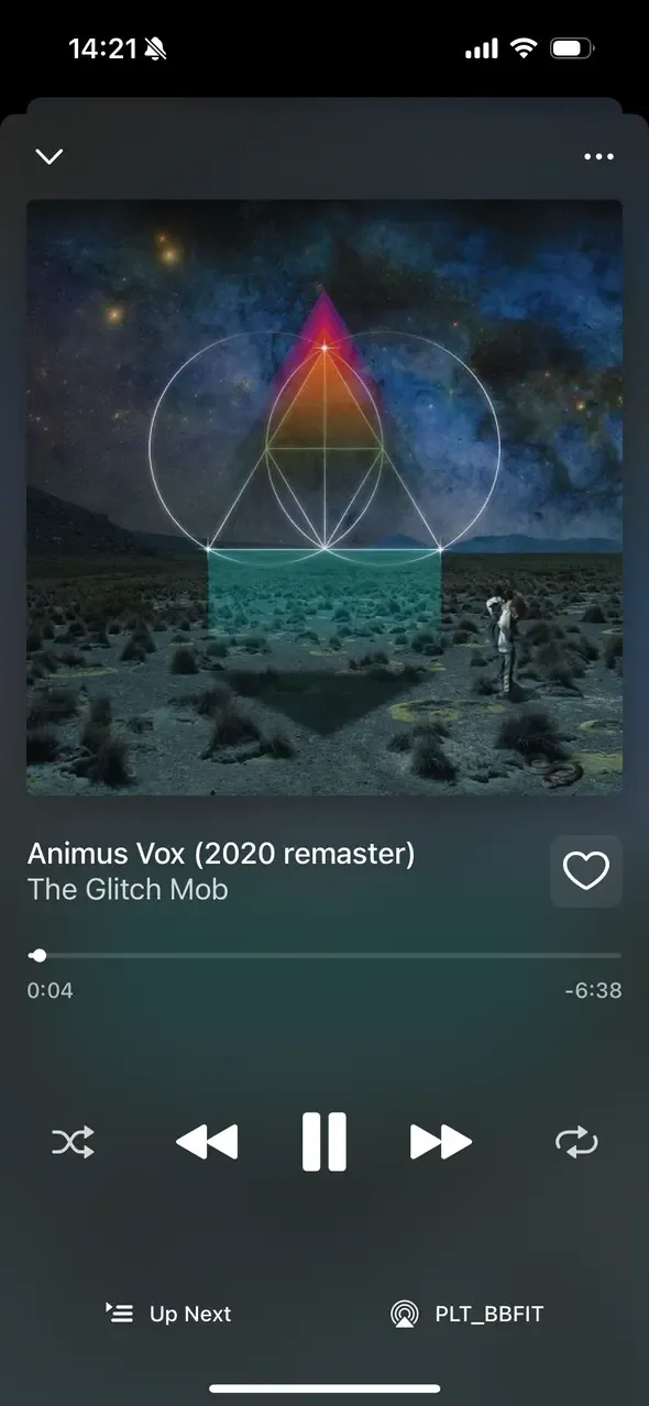 A screenshot of an iOS apps. It is a music player. The cover art is displayed prominently. Below it art the song name, album name, and music controls.